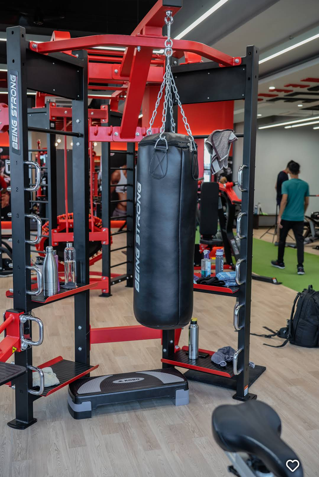 Being Strong combat training station with heavy punching bag